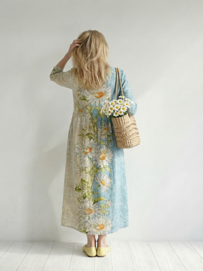 Woman wearing a floral dress holding a basket of flowers against a white background